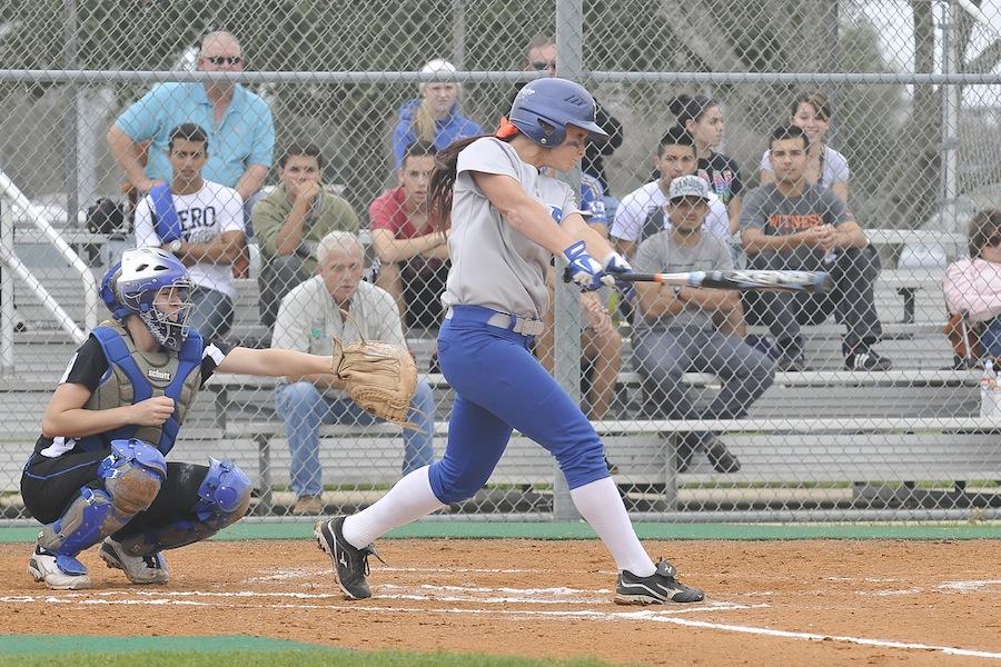 Left fielder Sarah Ragsdale takes an intense swing against McLennon Community College during a home game.