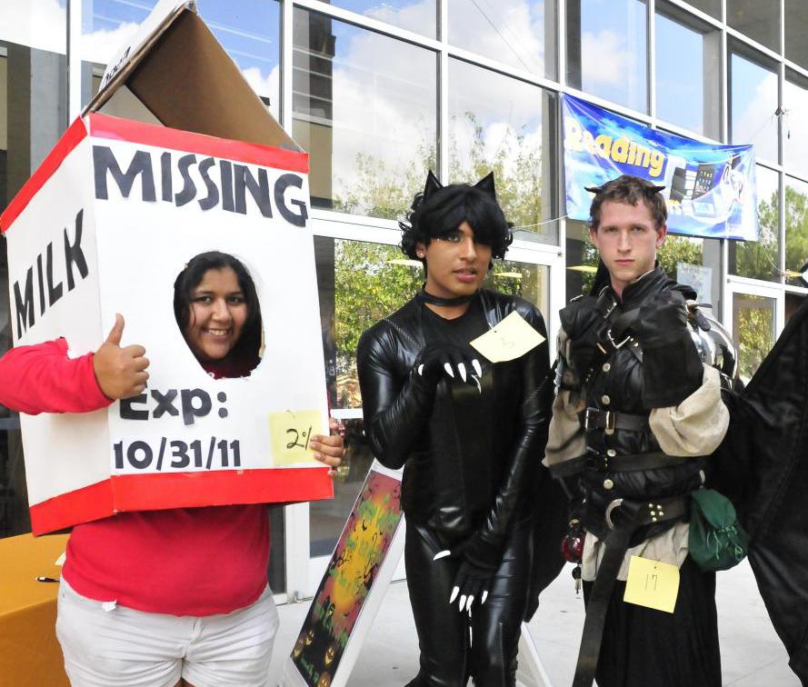 From left: Angie Langdon, Moises Jimenez and James Skeen proudly display their winning costumes at the 2011 Raven Rally.