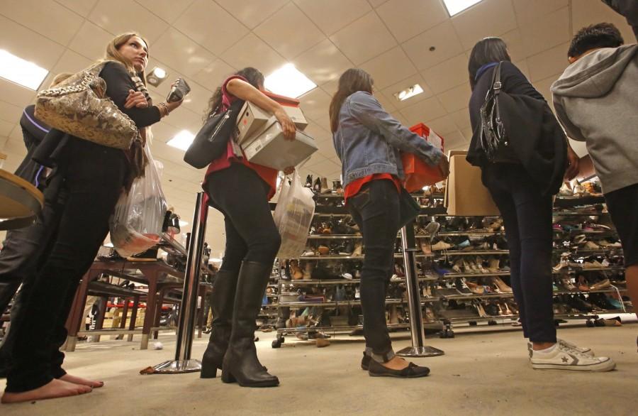 Like+many+other+Americans%2C+bargain-seekers+abandon+their+Thanksgiving+tables+to+battle+long+lines+at+Macys+in+Costa+Mesa%2C+Calif.%2C+last+year+on+Black+Friday+morning.+