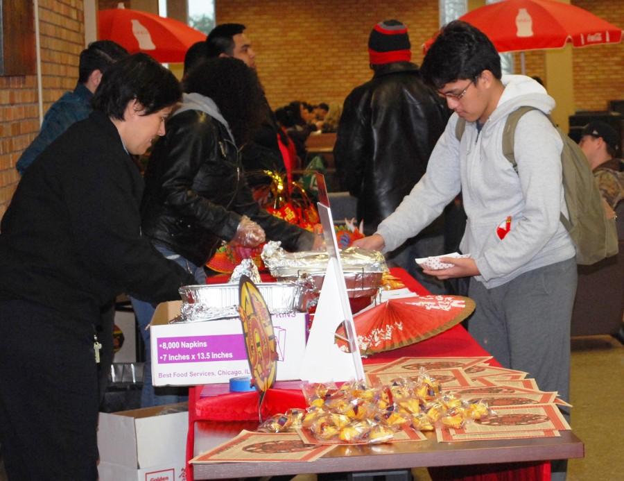 Students enjoy egg rolls and fortune cookies while commemorating the Year of the Sheep.  