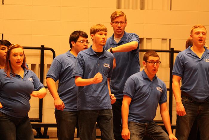 Members+of+the+San+Jacinto+College+Central+Chorale+perform+before+students+from+Louisiana+State+University+take+stage+on+March+10.%0AIncluding+%28from+left%29+Linda+Caldera%2C+Carlee+Harrigan%2C+John+Moran%2C+Brent+Regier%2C+Andy+Young%2C+Jonathan+Murphy%2C+and+Canyon+Headrick.%0A