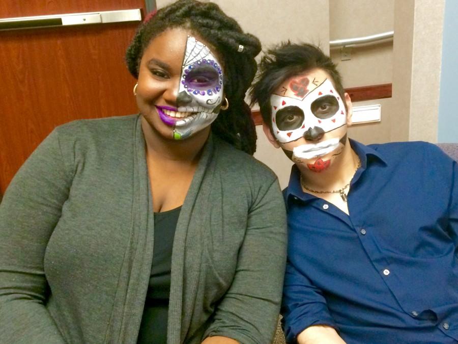 Students+Kiani+Johnson+and+Jimmy+Dur%C3%A1n+prepare+for+a+presentation+on+sugar+skulls.+Sugar+skulls+are+part+of+Dia+de+los+Muertos%2C+or+Day+of+the+Dead+celebrations.