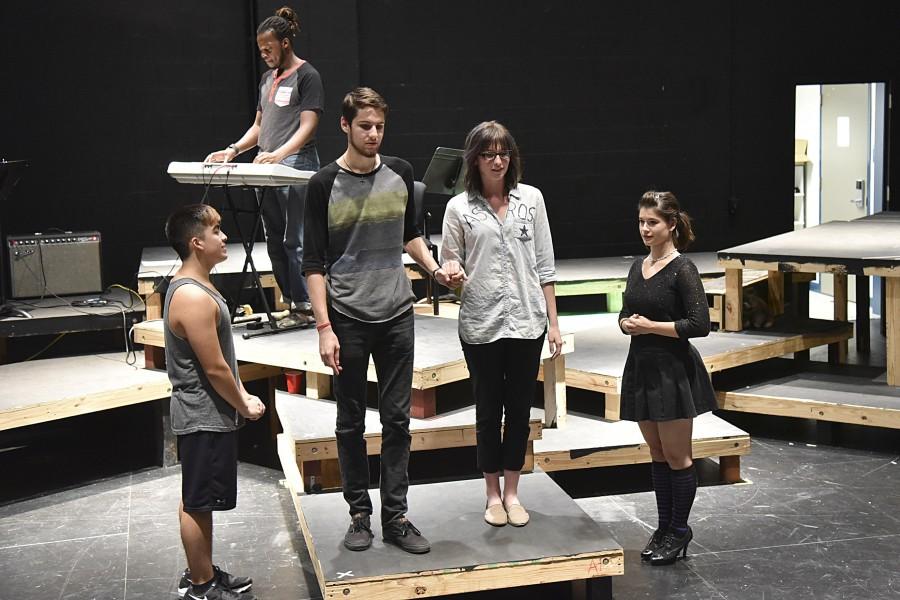 Cast members rehearse a scene from United States.  The show is an original collaboration by the South campus theater program.