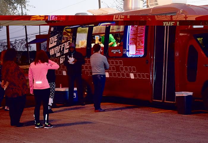 Students venture away from the vending machines and onto the parking lot of the South campus to taste a slew of new dining options available during evening classes. The Waffle Bus is one of several mobile eateries rotating between the San Jac campuses.  