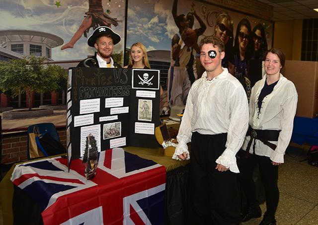 Ahoy matey! Students take a break from manning a pirate-themed booth during last year’s literary showcase dedicated to heroes and villains. The 2016 festival takes place April 26 in the Student Center (C14) on the Central campus.  