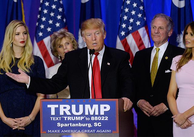 Republican presidential candidate Donald Trump (center), flanked by his daughter Ivanka (left), and his wife Melania Trump, speaks during a primary watch party at the Marriott on Feb. 20 in Spartanburg, S.C.
