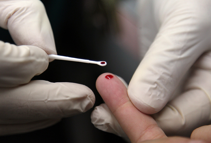 A student has blood drawn during a demonstration for HIV testing at Miami Jackson Senior High School in Miami, Fla. San Jacinto College students can receive rapid results during free screenings offered on Nov. 30.