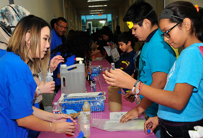 Middle+school+students+participate+in+hands-on+activities+at+a+2016+STEM+showcase.++