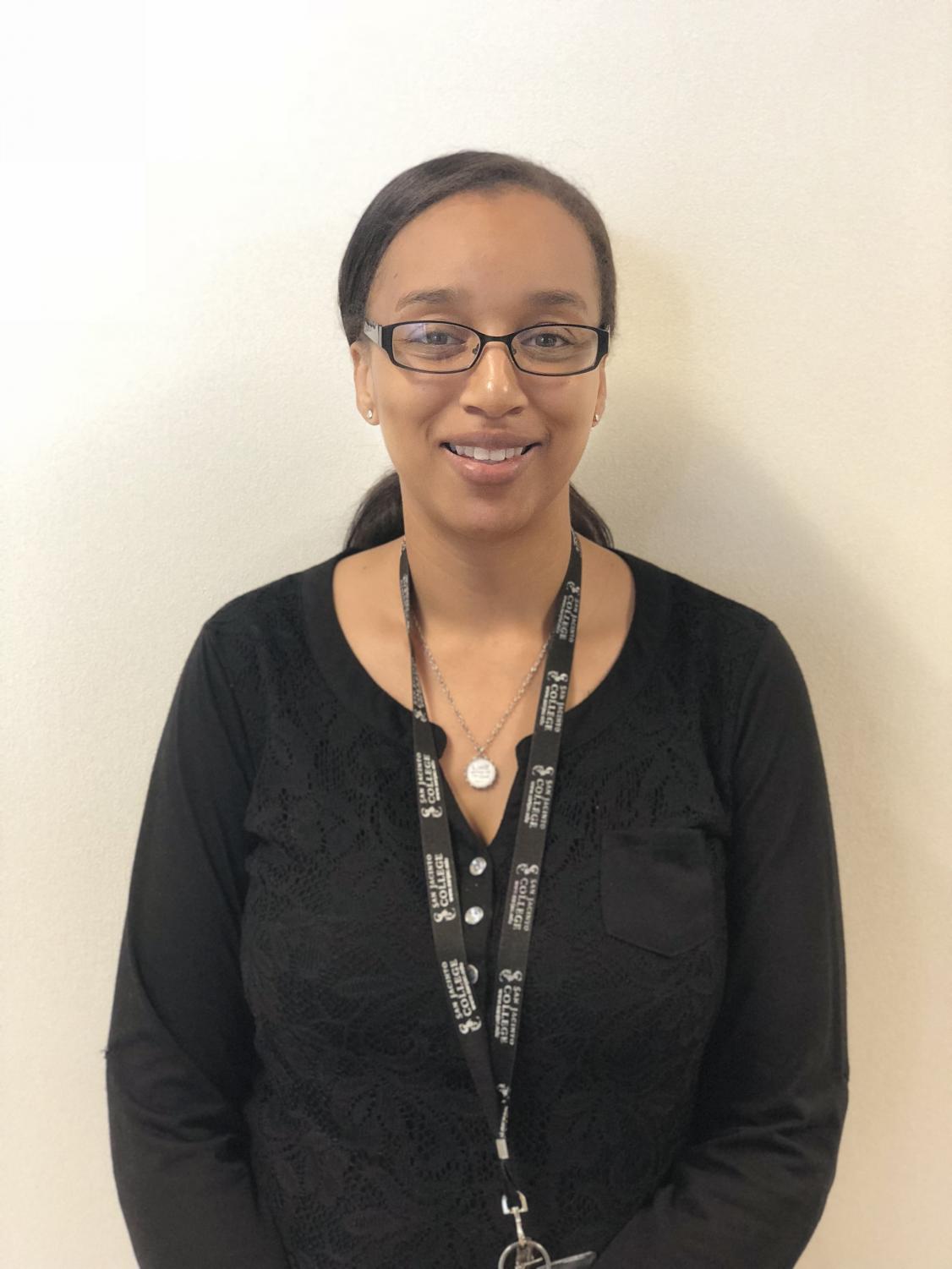 Biology professor Aleshia Seaton helped organize the poster symposium where in contrast to traditional employment fairs, professionals approach students about their field of interest