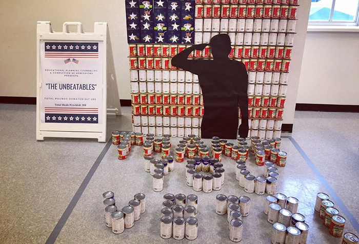 On the North Campus, The Unbeatables use ravioli cans to spell out “Thank You Vets!” as part of their Canstruction submission.