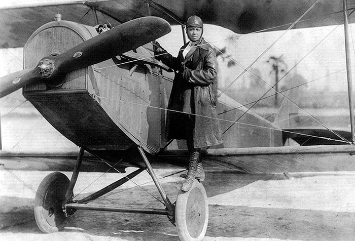 Bessie Coleman, pictured here with her plane in 1922, became the first female civil aviator when she earned her pilot’s license in 1921.